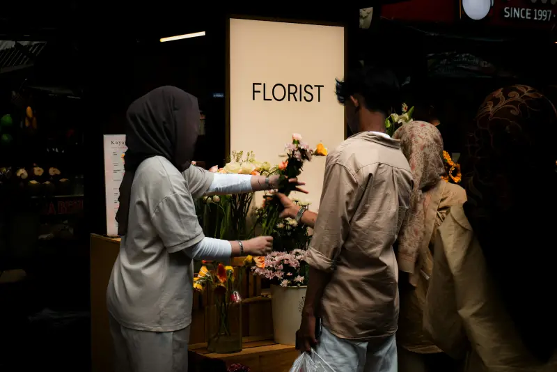 A florist arranging flowers in her shop